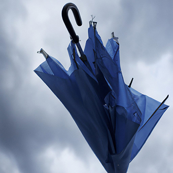 picture of a blue broken umbrella